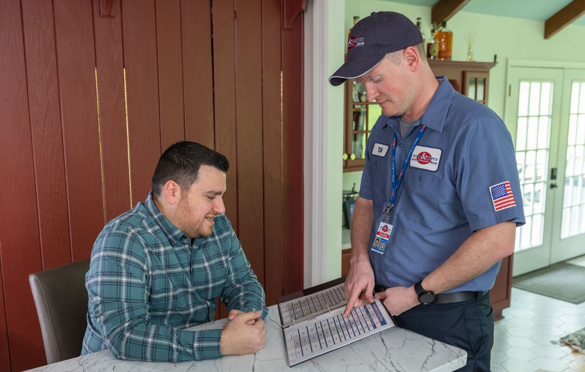 technician shaking hands with a not-for-profit HVAC client